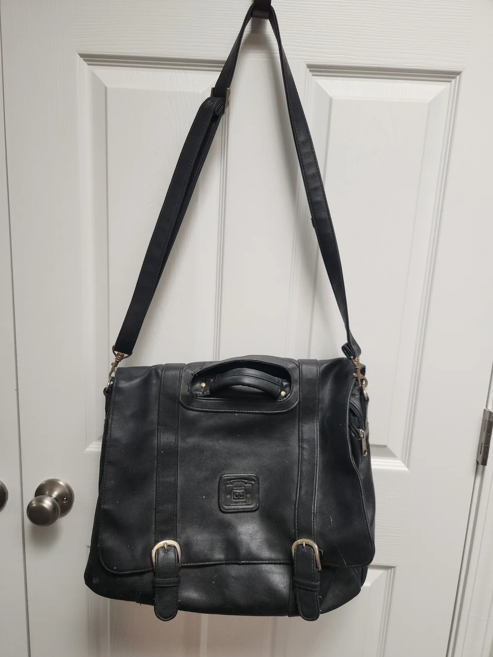 Black Leather Messenger Bag with Top Handle and Adjustable Shoulder Strap